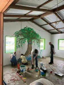Creating a new school room during our International Teen Service Trip to Belize as a way to change self-perceptions with struggling teenagers.